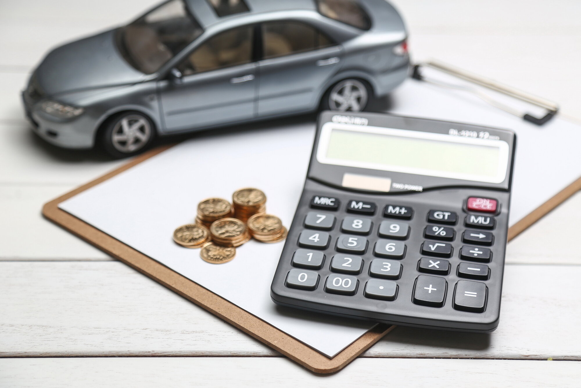 car-model-calculator-coins-white-table car-model-calculator-coins-white-table